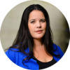 Professional headshot of Indigenous woman in blue cardigan.