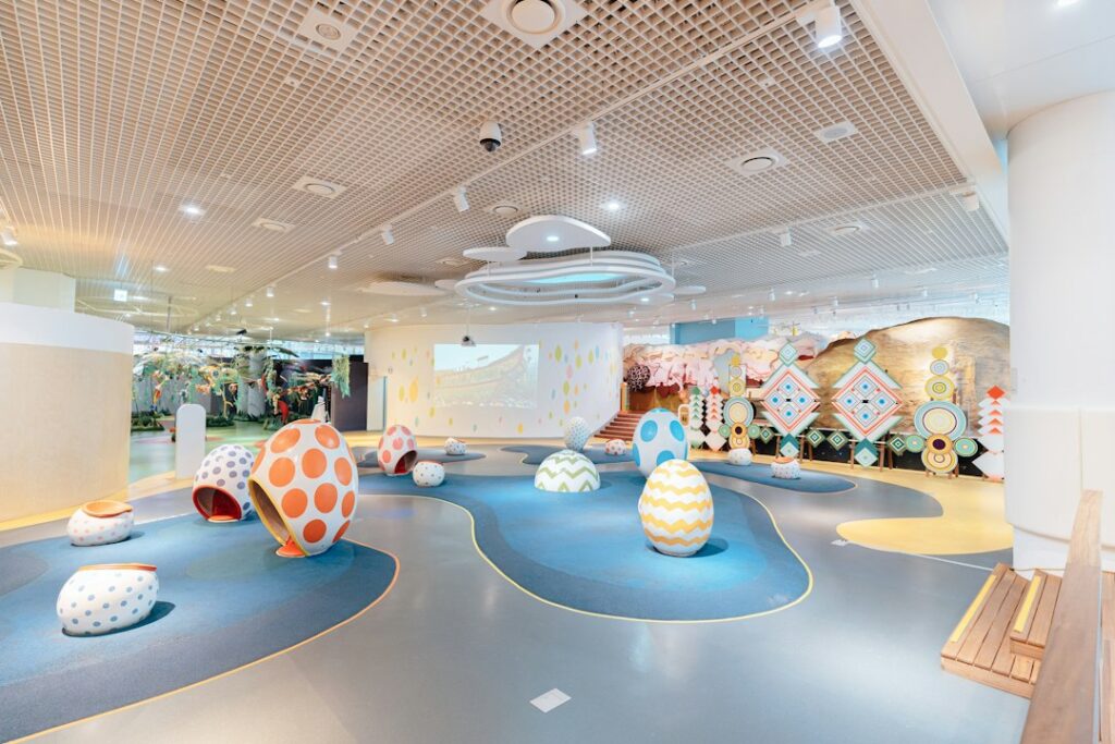 a large room with a large colorful ball in it