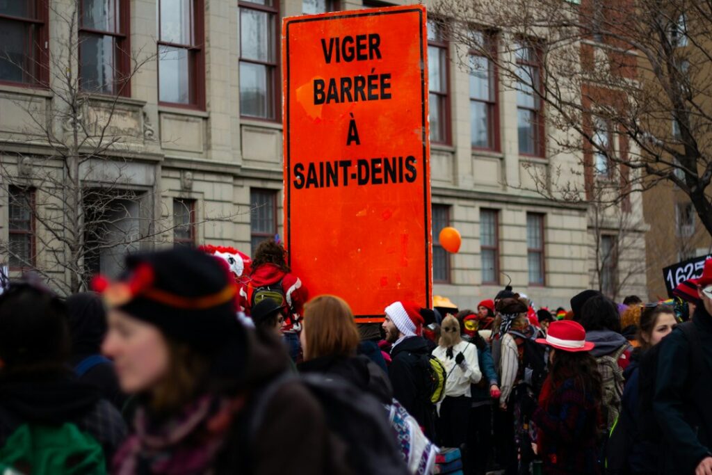 a group of people holding a sign